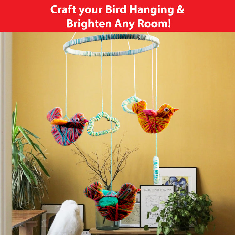 Completed Chalk and Chuckles Yarn Birds mobile hanging—colorful yarn-wrapped birds and clouds make a beautiful, handmade room decor piece. A useful and aesthetic craft kit for kids, girls, or adults who enjoy creative DIY art with a functional finish.
