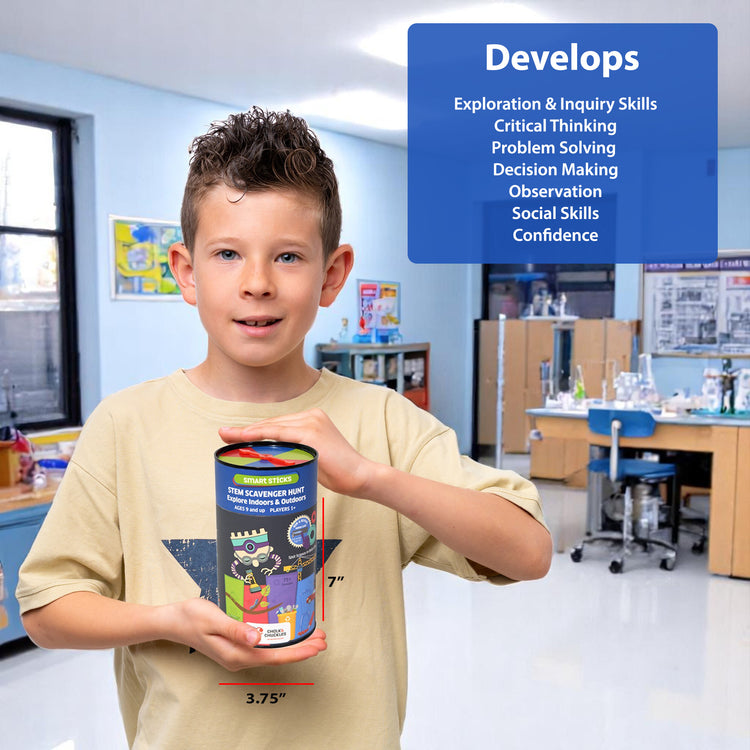 Child holding the Chalk and Chuckles STEM Scavenger Hunt game box in a classroom. Shows game size (7" x 3.75") and skills developed, including critical thinking, problem solving, observation, and confidence. Perfect educational STEM toy for kids ages 8–12.