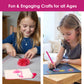 Two girls enjoying creative activities from Chalk and Chuckles craft kit, one making a pom-pom and the other using a stylus to place diamond stickers on colorful art sheets
